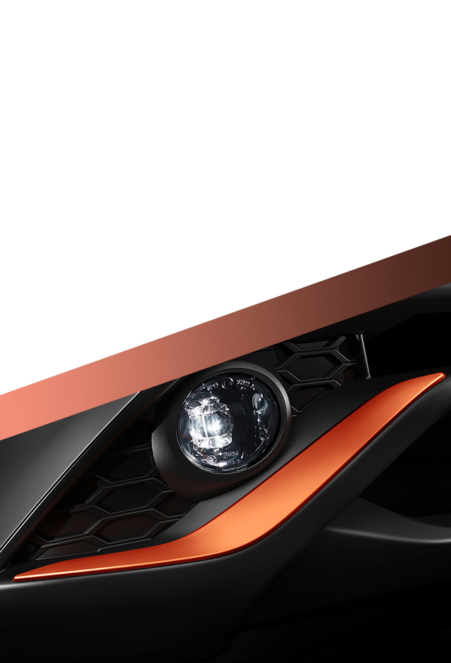 Nouveau Nissan JUKE détail de la finition de pare-chocs avant orange racing